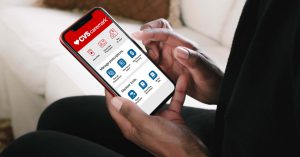 Image of a woman's hands using the CVS Caremark app on a mobile phone.
