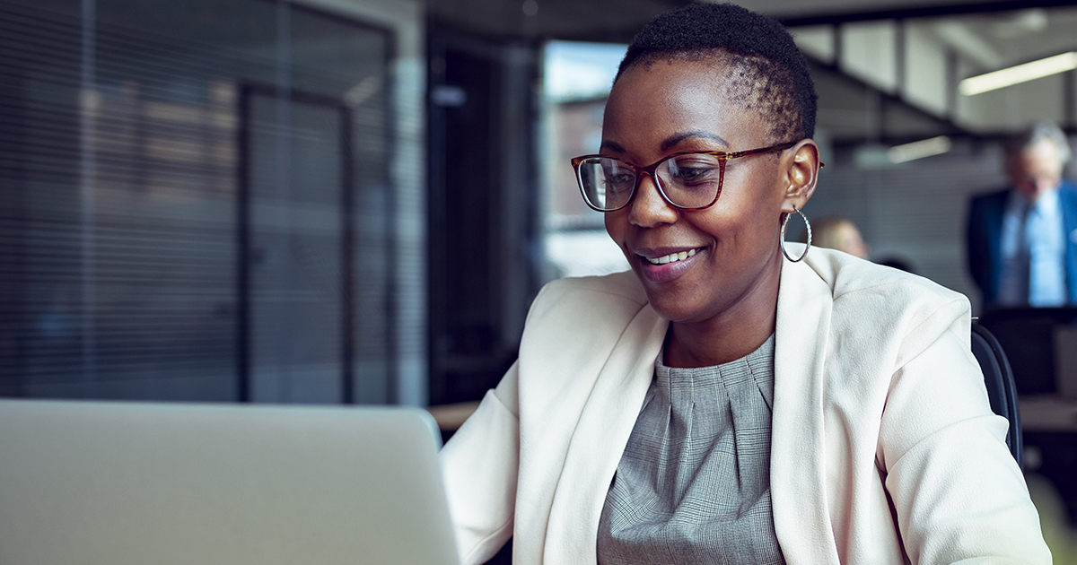 Close up of a young businesswoman working in an office.