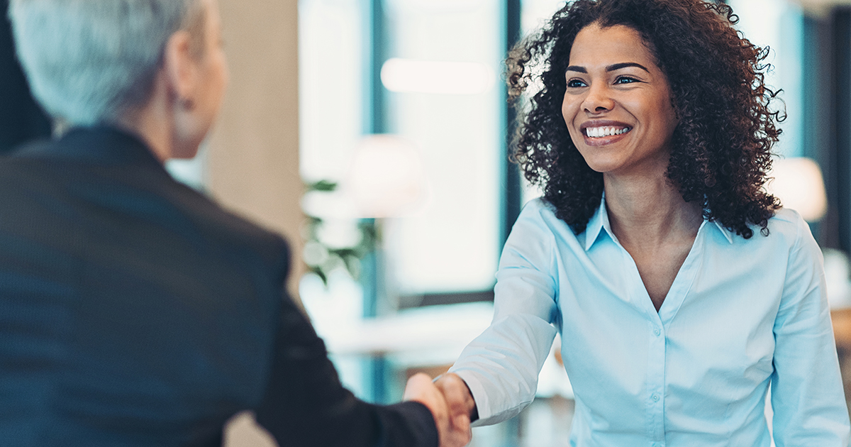 Businesswomen shaking hands in the office